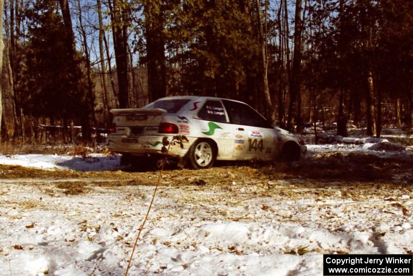 The Charlie Langan / Hughie Langan Ford Escort GT takes the hairpin on SS7, Ranch II.