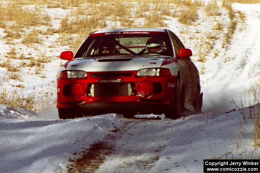 Garen Shrader / Doc Shrader at speed on SS7, Ranch II, in their Mitsubishi Lancer Evo IV.