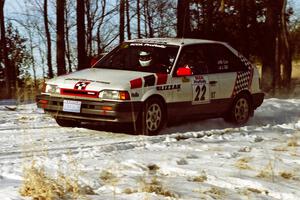 Mark Cox / Jim Gill slow for the hairpin on SS7, Ranch II, in their Mazda 323GTX.