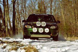 Tad Ohtake / Cindy Krolikowski set up for the hairpin on SS7, Ranch II, in their Ford Escort ZX2.