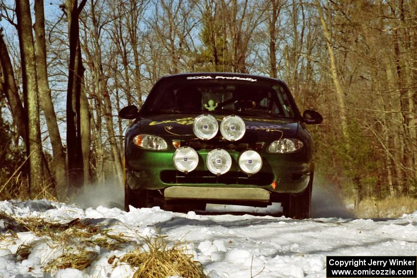 Tad Ohtake / Cindy Krolikowski set up for the hairpin on SS7, Ranch II, in their Ford Escort ZX2.