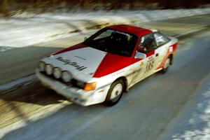 The Jon Bogert / Daphne Bogert Toyota Celica All-Trac at speed on SS9, Avery Lake II, before sunset.