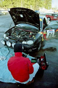 The Evan Moen / Kurt Winkelmann Chrysler Neon gets serviced during the dinner break.