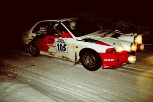 Bill Morton / Rob Walden set up their Mitsubishi Lancer Evo IV for a 90-right on SS13, McCormick Lake.