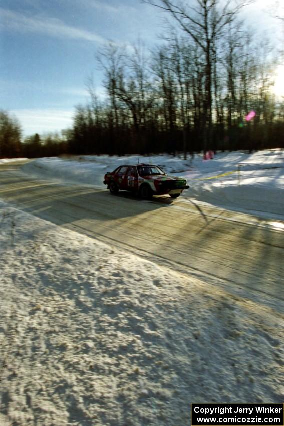 The Carlos Arrieta, Sr. / Dick Casey Audi 4000 Quattro at speed on SS9, Avery Lake II, just before sundown.