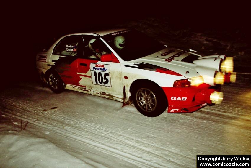 Bill Morton / Rob Walden set up their Mitsubishi Lancer Evo IV for a 90-right on SS13, McCormick Lake.