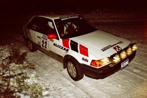 The Mark Cox / Jim Gill Mazda 323GTX prepares for a right-hander on SS13, McCormick Lake.