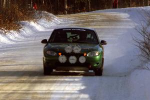 Tad Ohtake / Cindy Krolikowski at speed down a straight in their Ford Escort ZX2 on SS9, Avery Lake II.