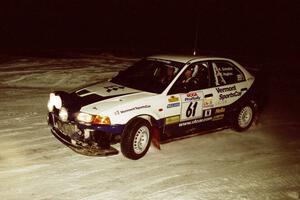 The Karl Scheible / Russ Hughes Mitsubishi Lancer Evo V drifts through a 90-left on SS16, the final stage.