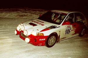 Bill Morton / Rob Walden drift their Mitsubishi Lancer Evo IV through a 90-left on SS16, the final stage.