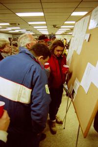 Hughie Langan and a few other drivers check the results.