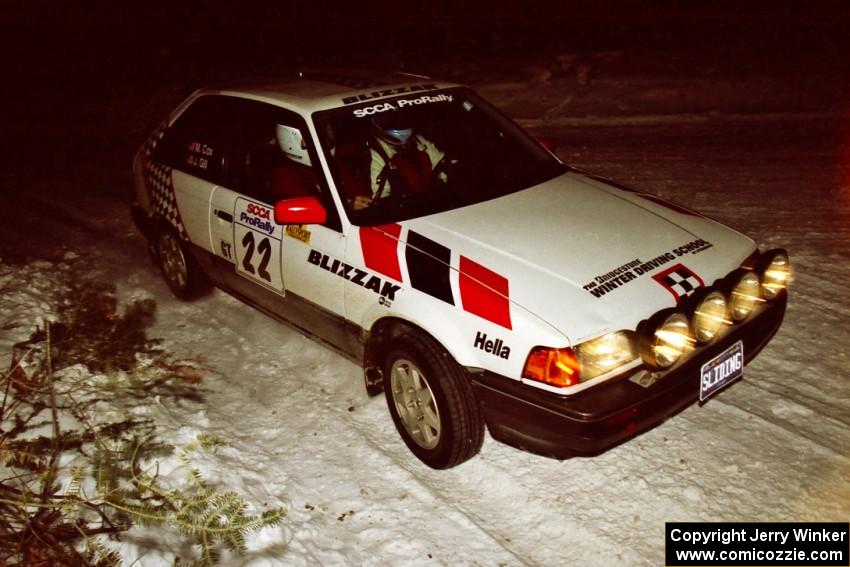 The Mark Cox / Jim Gill Mazda 323GTX prepares for a right-hander on SS13, McCormick Lake.