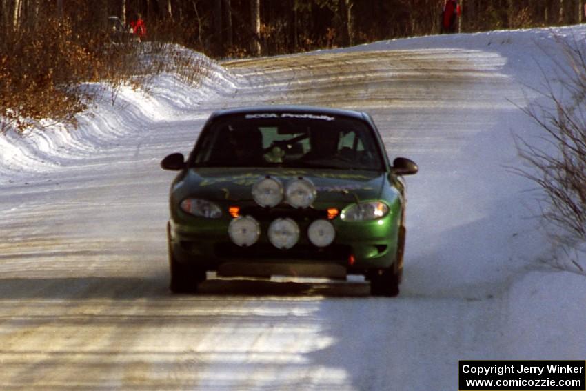 Tad Ohtake / Cindy Krolikowski at speed down a straight in their Ford Escort ZX2 on SS9, Avery Lake II.