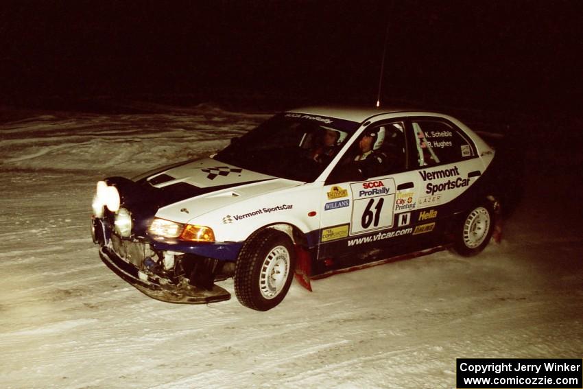 The Karl Scheible / Russ Hughes Mitsubishi Lancer Evo V drifts through a 90-left on SS16, the final stage.