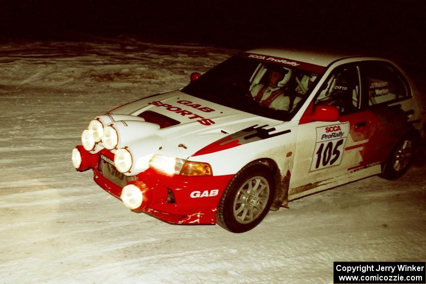 Bill Morton / Rob Walden drift their Mitsubishi Lancer Evo IV through a 90-left on SS16, the final stage.