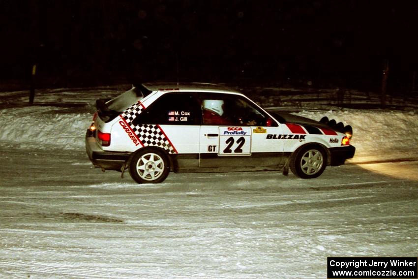 The Mark Cox / Jim Gill Mazda 323GTX heads through a 90-left on SS16, the final stage.