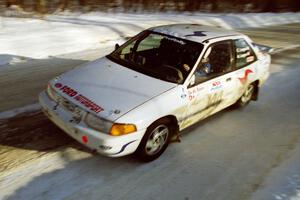 The Charlie Langan / Hughie Langan Ford Escort GT at speed on SS9, Avery Lake II, late in the day.