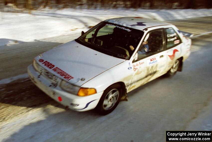 The Charlie Langan / Hughie Langan Ford Escort GT at speed on SS9, Avery Lake II, late in the day.