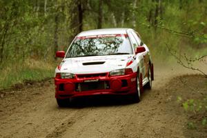Bill Morton / Mike Busalacchi at speed over the yump in their Mitsubishi Evo IV on Indian Creek Rd., SS1.