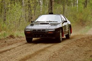 Dave Hintz / Doug Chase at speed in their Mazda RX-7 on Indian Creek Rd., SS1.