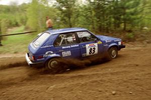 Mark Utecht / Brenda Corneliusen in their Dodge Omni GLH-Turbo at the first corner of SS1.
