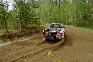 The Ken Stewart / Doc Shrader Chevy S-10 drifts through the first turn of SS1, Indian Creek Rd.