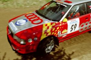 John Rek / Rob Dupree drift their Audi S2 Quattro through the first turn of SS1, Indian Creek Rd.