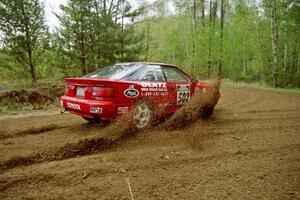 Paul Dunn / Rebecca Dunn throw a spray of gravel from their Toyota Celica All-Trac at the first 90-left on SS1. Indian Creek Rd.