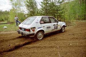 John Zoerner / John Shepski drift their Dodge Omni GLH-Turbo through the first corner of SS1.