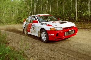 Bill Morton / Mike Busalacchi at speed in the Two Inlets State Forest in their Mitsubishi Lancer Evo IV.