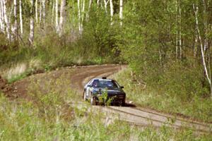 Dave Hintz / Doug Chase at speed in their Mazda RX-7 in the Two Inlets State Forest.