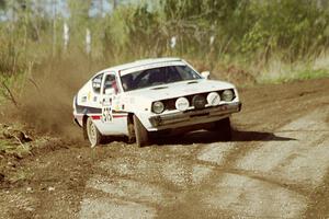 Jeremy Butts / Jon Vrzal in their Plymouth Arrow hang the tail out at a sweeper in the Two Inlets State Forest.