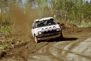 Doug Davenport / Lea Davenport drift their VW GTI wide through a sweeper in the Two Inlets State Forest.