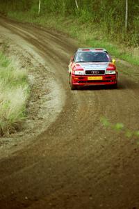 John Rek / Rob Dupree at speed through a fast sweeper in the Two Inlets State Forest in their Audi S2 Quattro.
