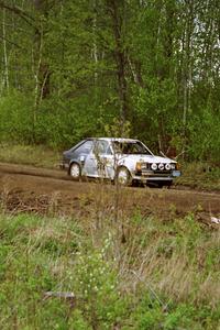Jim Buchwitz / C.O. Rudstrom at speed in their Ford Escort in the Two Inlets State Forest.