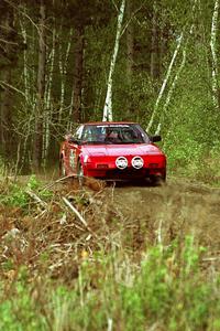 Phil Schmidt / Steve Irwin at speed in their Toyota MR-2 in the Two Inlets State Forest.