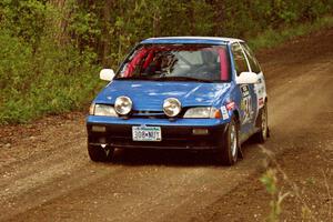 Dan Moore / John Hopponen at speed in their Suzuki Swift GTi in the Two Inlets State Forest.