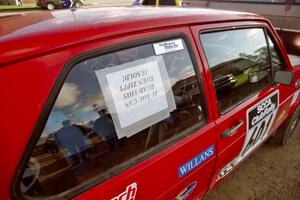 Note in the rear window of the Mike Halley / Emily Burton-Weinman VW Rabbit at service.