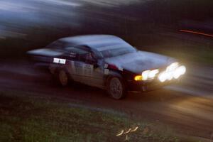 The Mike Hurst / Rob Bohn Pontiac Sunbird Turbo at speed at the crossroads.