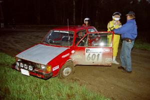 The Mike Halley / Emily Burton-Weinman VW Rabbit pulls off the road and out of the event at the crossroads.