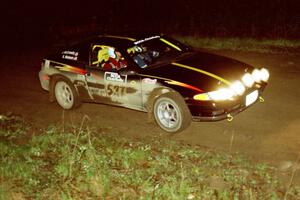 The Steve Nielsen / Jeff Burmeister Plymouth Laser goes past the spectator point at the crossroads.