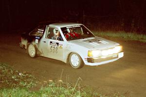Jim Buchwitz / C.O. Rudstrom at speed in their Ford Escort at the crossroads spectator point.