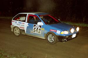 Dan Moore / John Hopponen at speed in their Suzuki Swift GTi at the crossroads.