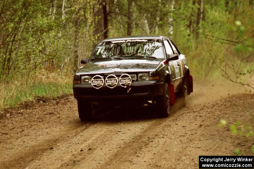 The Mike Hurst / Rob Bohn Pontiac Sunbird Turbo at speed on Indian Creek Rd., SS1.