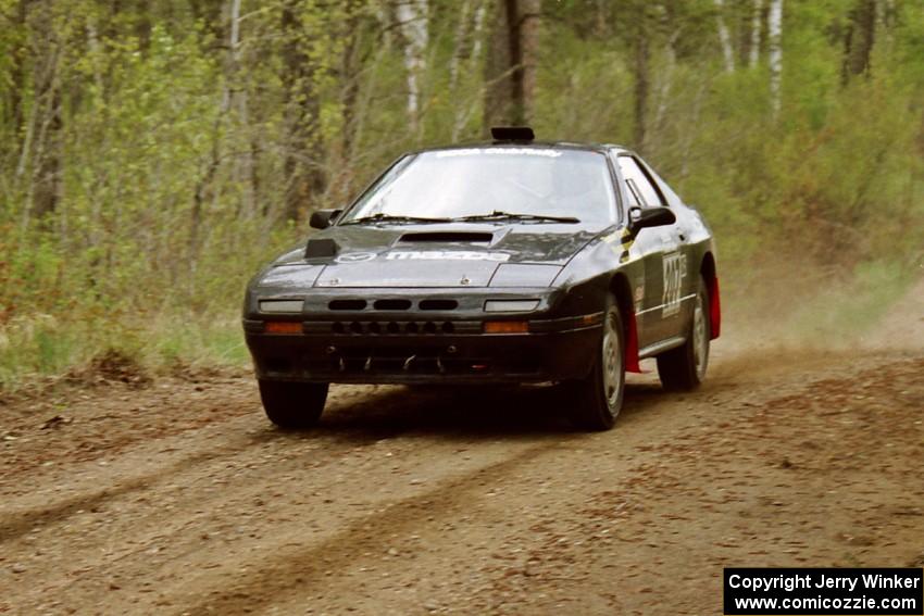 Dave Hintz / Doug Chase at speed in their Mazda RX-7 on Indian Creek Rd., SS1.