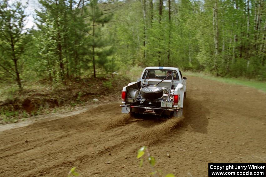 The Ken Stewart / Doc Shrader Chevy S-10 drifts through the first turn of SS1, Indian Creek Rd.