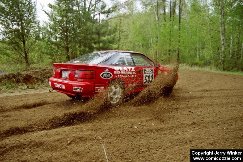 Paul Dunn / Rebecca Dunn throw a spray of gravel from their Toyota Celica All-Trac at the first 90-left on SS1. Indian Creek Rd.