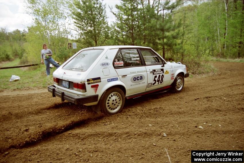 John Zoerner / John Shepski drift their Dodge Omni GLH-Turbo through the first corner of SS1.