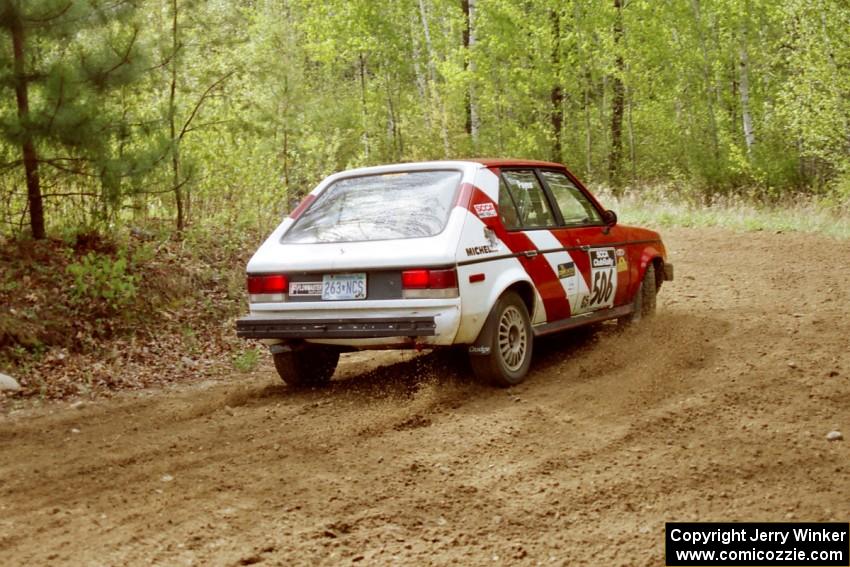 Erik Payeur / Adam Payeur in their Dodge Omni on SS1.