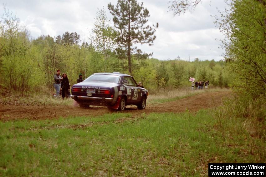 Mark Kleckner / Jeff Hribar get cheered on Indian Creek Rd., SS1, in their Dodge Colt.